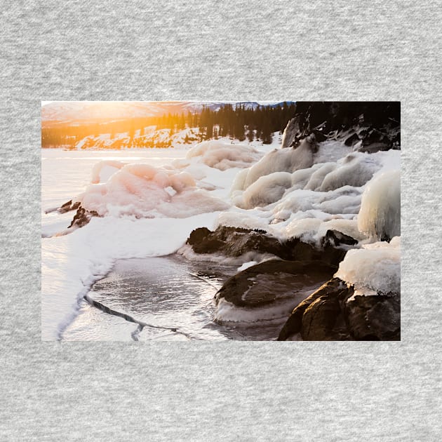 Warmth of orange sunlight on ice covered rocks by ImagoBorealis